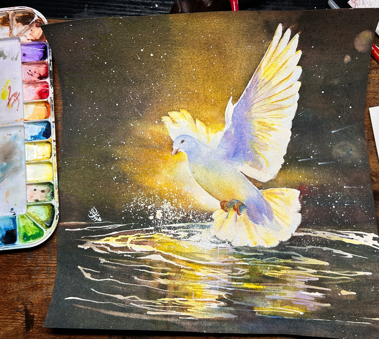 The artwork "Touched By Spirit" beautifully illustrates a serene white dove gracefully gliding above a tranquil pond. As its delicate wings slice through the air, the dove dips down to touch the water's still surface, sending ripples radiating outward and creating a lively explosion of droplets that shimmer in the light. The scene captures a moment of pure elegance and connection between the bird and the water, evoking a sense of peace and harmony in nature and divine force.