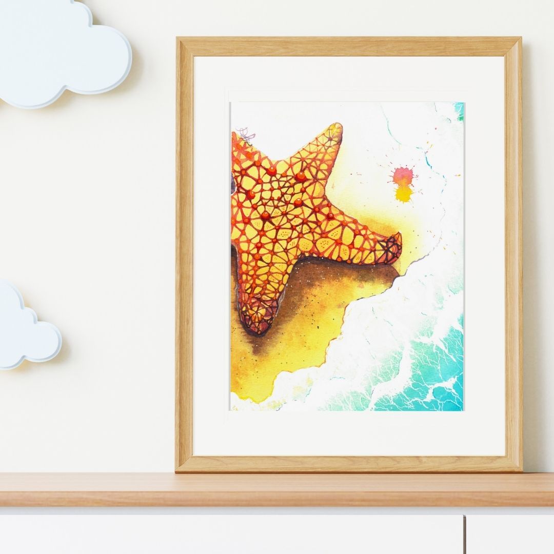 The artwork titled "Starfish" features a stunningly vibrant starfish, adorned with brilliant hues of yellow and red, gracefully positioned on a soft, foamy beach. The intricate details of the starfish contrast beautifully against the shimmering sand, inviting viewers to appreciate the beauty of nature's artistry.