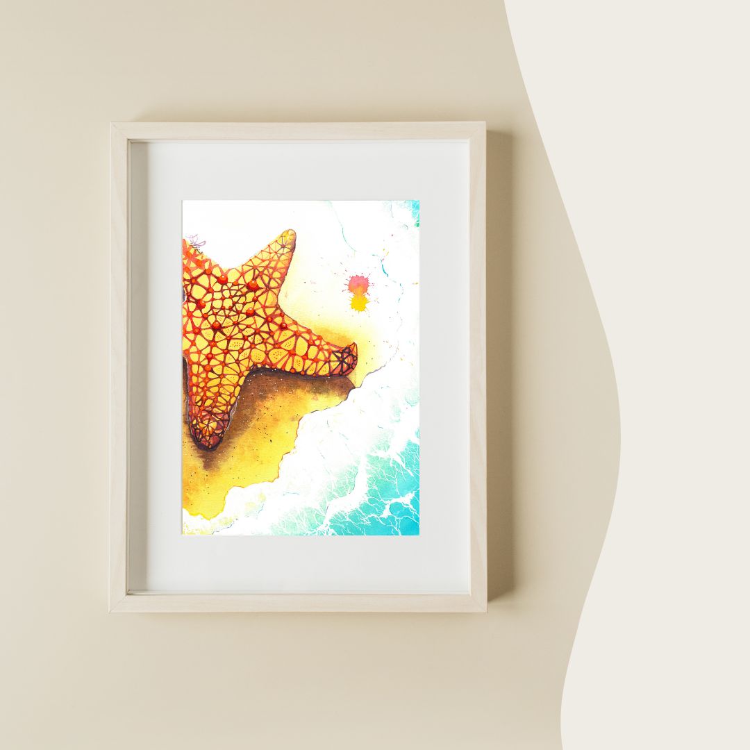 The artwork titled "Starfish" features a stunningly vibrant starfish, adorned with brilliant hues of yellow and red, gracefully positioned on a soft, foamy beach. The intricate details of the starfish contrast beautifully against the shimmering sand, inviting viewers to appreciate the beauty of nature's artistry.