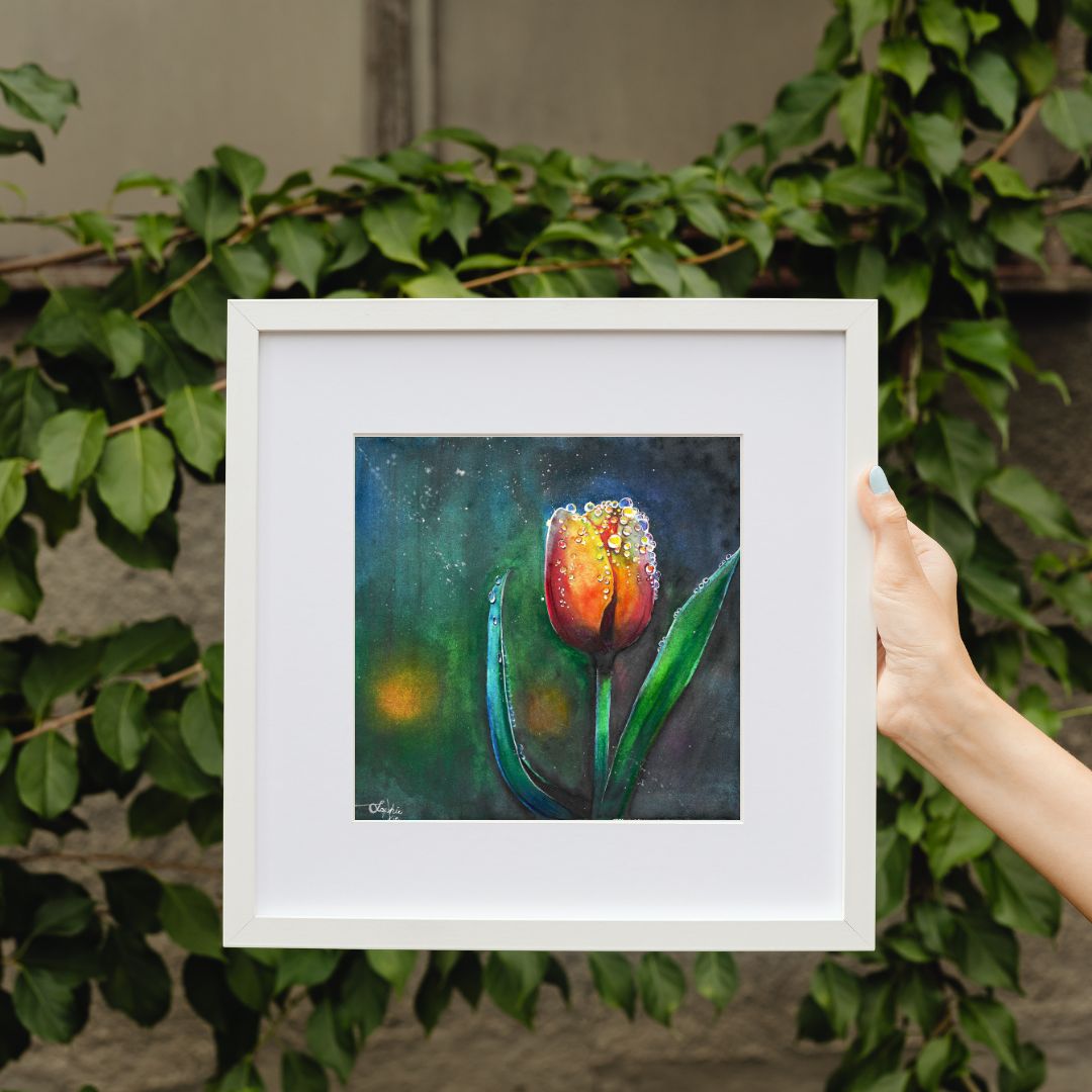 The artwork titled "Tulip" beautifully captures a half-bloomed tulip, its delicate petals unfolding gracefully. The flower is adorned with shimmering raindrops that cling to its surface, reflecting light and creating a sparkling effect that enhances the vibrant hues of the petals. The scene evokes a sense of freshness and vitality, celebrating the beauty of nature in a single moment.